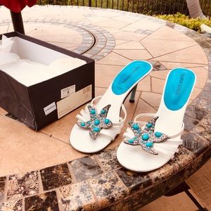 white  sandals with turquoise heels and accents